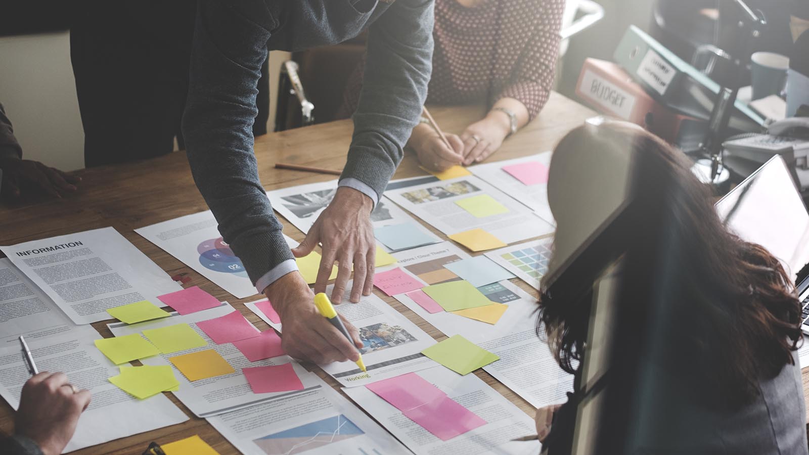 Criminalistic analysis Investigators at a detective agency analyze case files on a desk